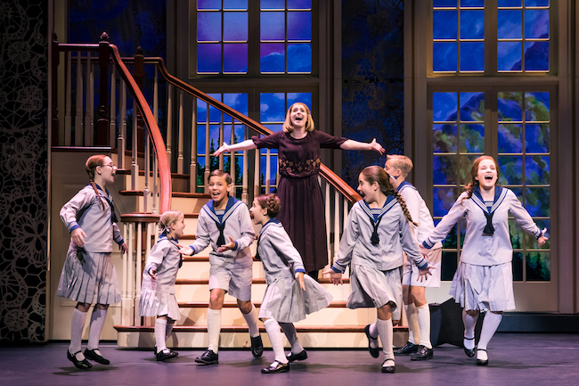 Jill-Christine Wiley as Maria Rainer and the von Trapp children Photo by Matthew Murphy