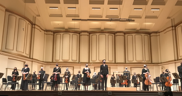 Stephanie Childress takes a curtain call with the  SLSO strings