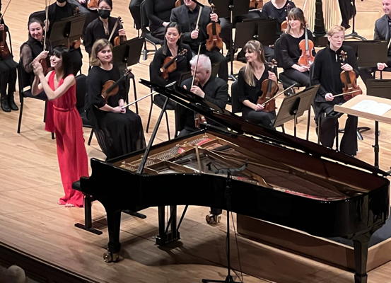 Alice Sara Ott curtain call. Photo by Chuck Lavazzi.